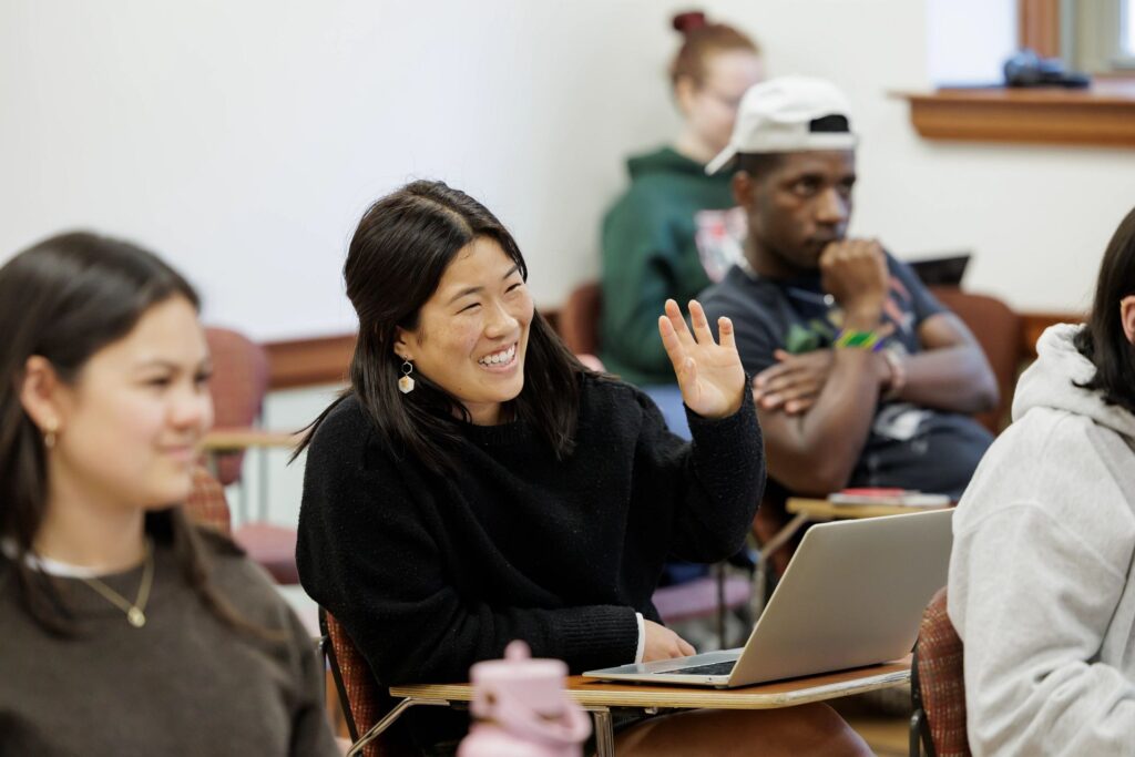 A student raises their hand during class